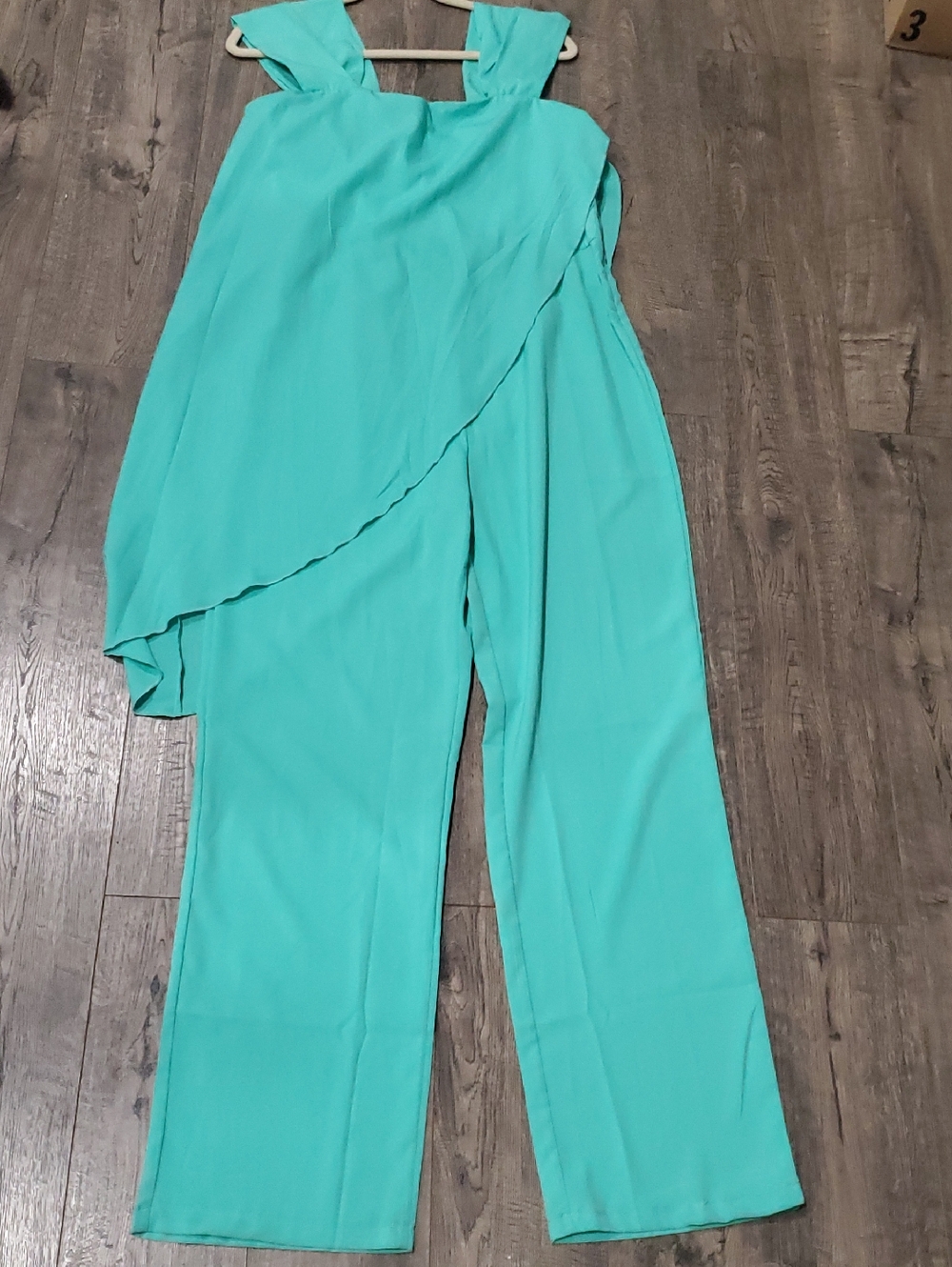 Sleeveless Turquoise Wide-Leg Jumpsuit with Draped Asymmetrical Overlay